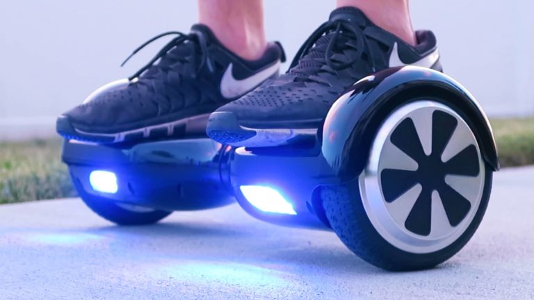 A person standing on a hoverboard