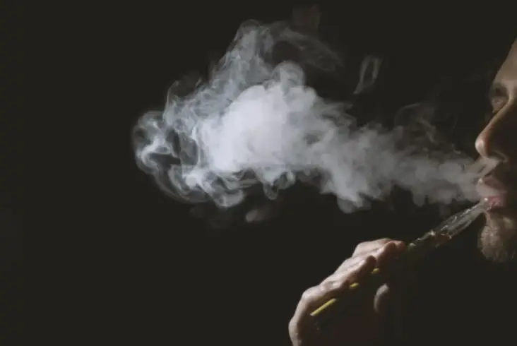 a man vaping an e-cigarette