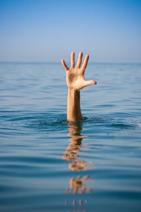 swimmer hand above water
