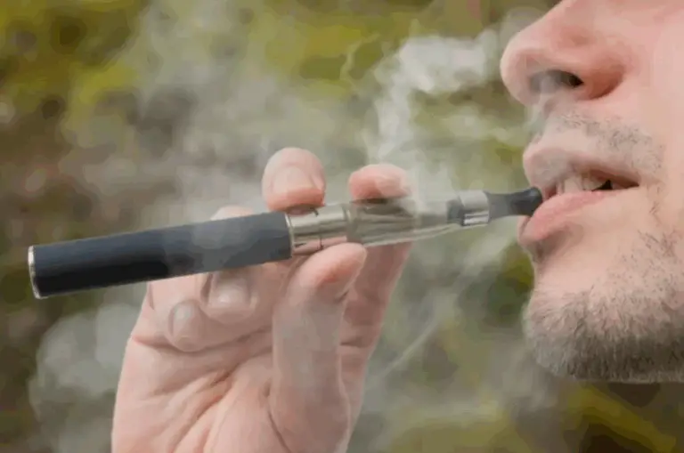 A man smoking an e-cigarette