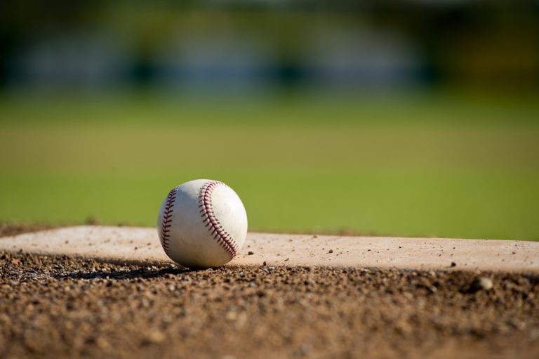 A baseball sitting on the field