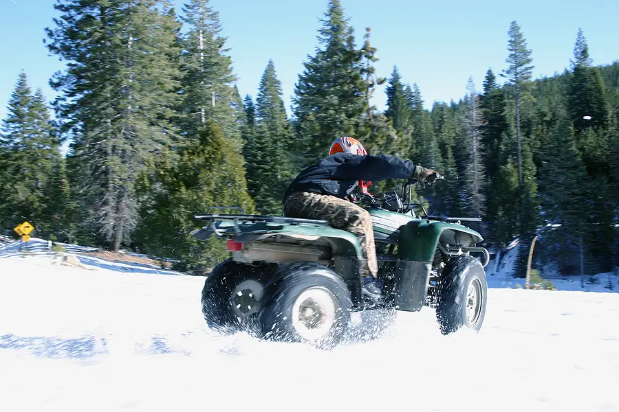 ATV speeding through the snow