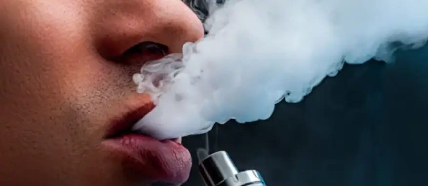 a teen vaping