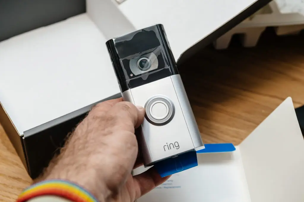 a doorbell camera device being unboxed