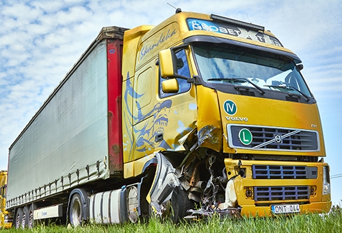 A semi-trailer truck with a damaged front after being involved in a truck accident
