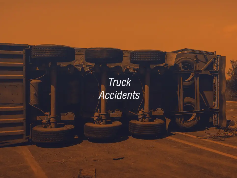 A big rig laying on its side