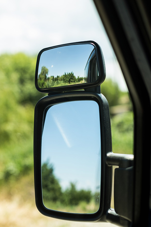 Side mirror of street sweeper truck
