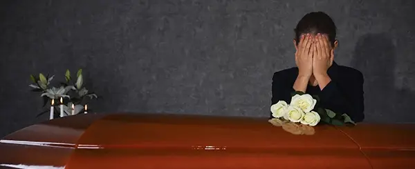 A widow over a casket
