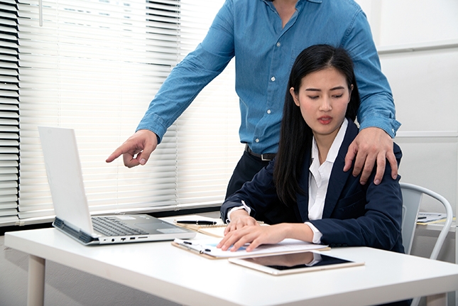 Man touching woman's shoulder.