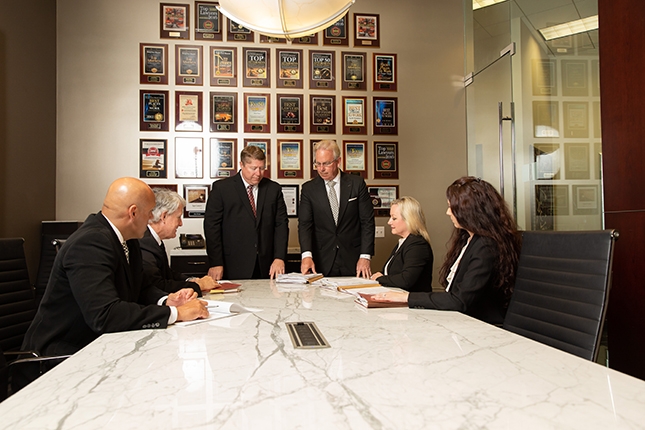 Personal injury lawyers collaborating in office