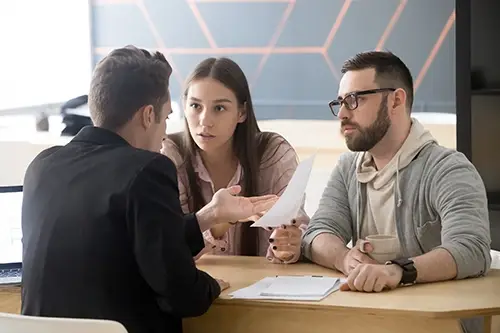 Clients speaking with a lawyer.