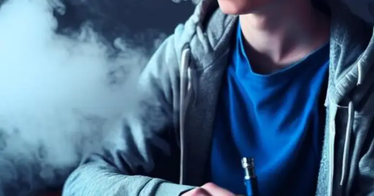 a teen vaping an e-cigarette