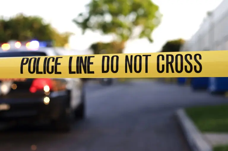 Police tape blocking accident scene