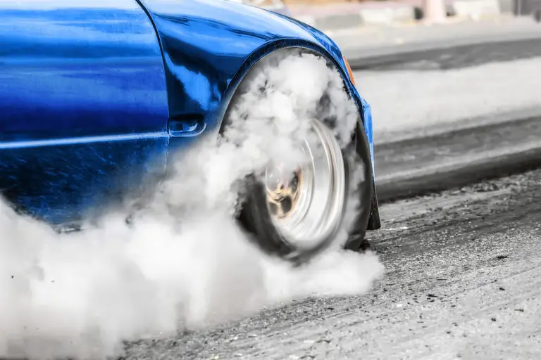 Car spinning its wheels at a street takeover