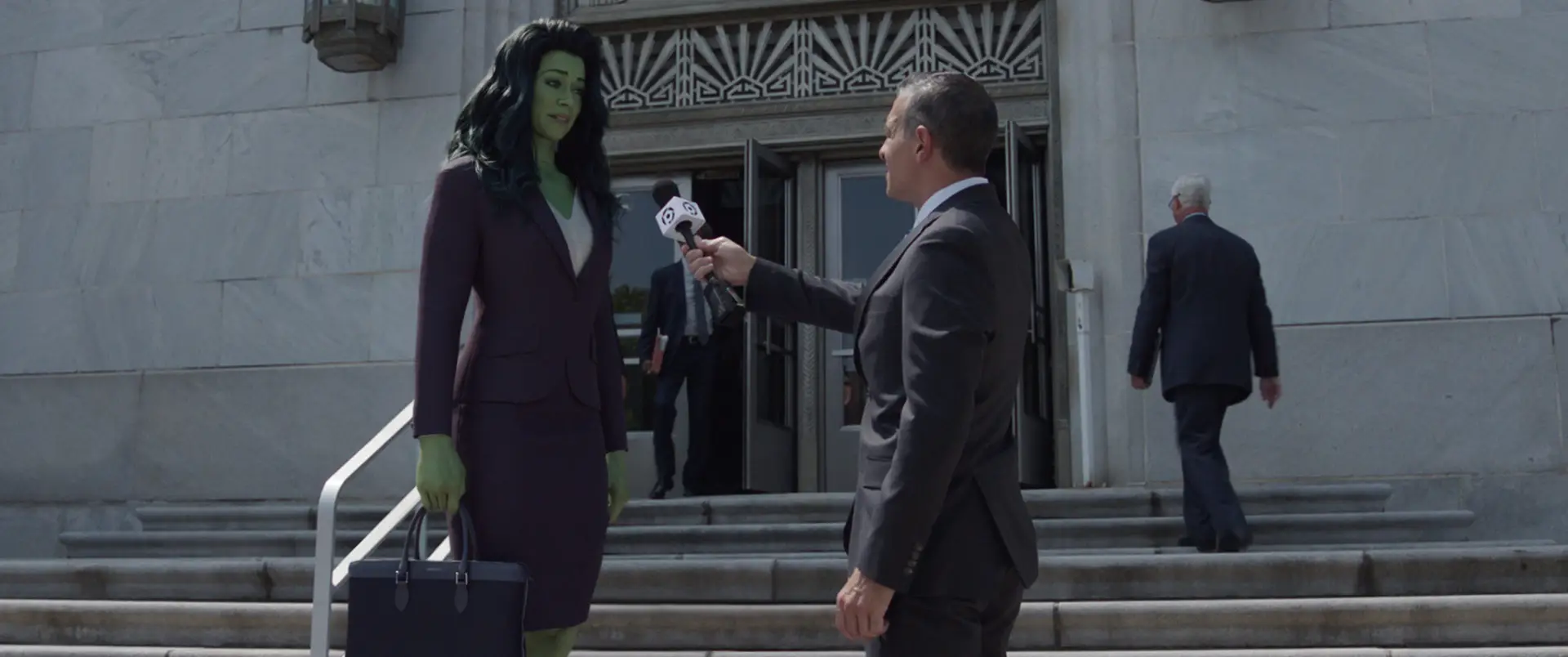 She-Hulk is interviewed on the courtroom steps in episode 9