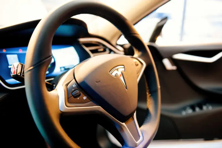 The interior and steering wheel of a self-driving Tesla car