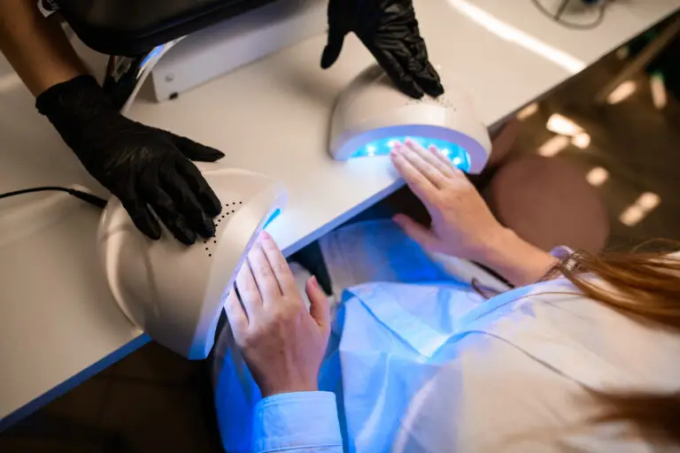 A UV lamp being used to dry gel nails
