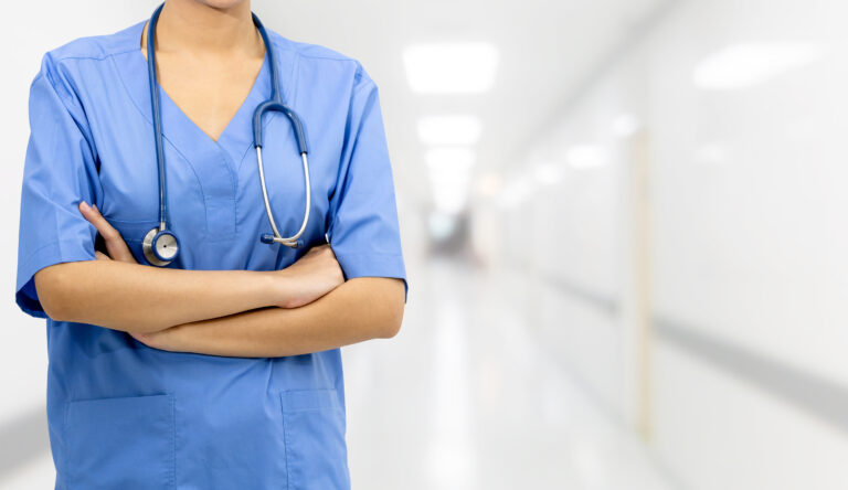 A female doctor standing in a hospital hallway