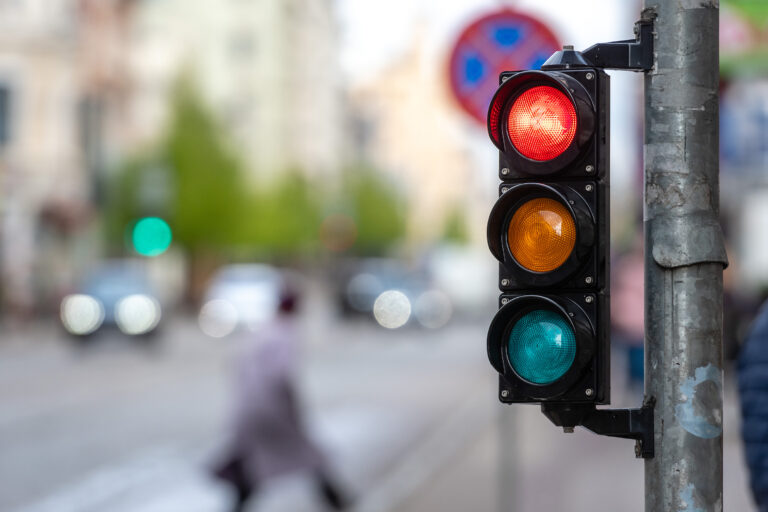A red traffic light at a pedestrian crossing