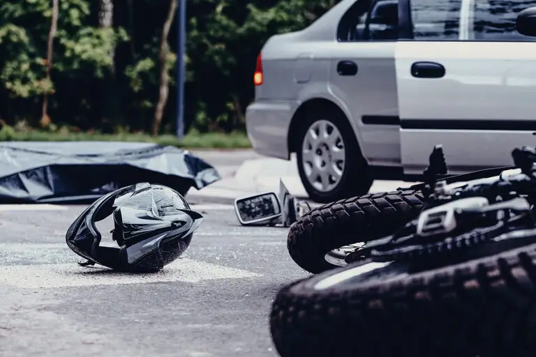 Motorcycle Helmet On The Street After Terrible Car Crash, Black