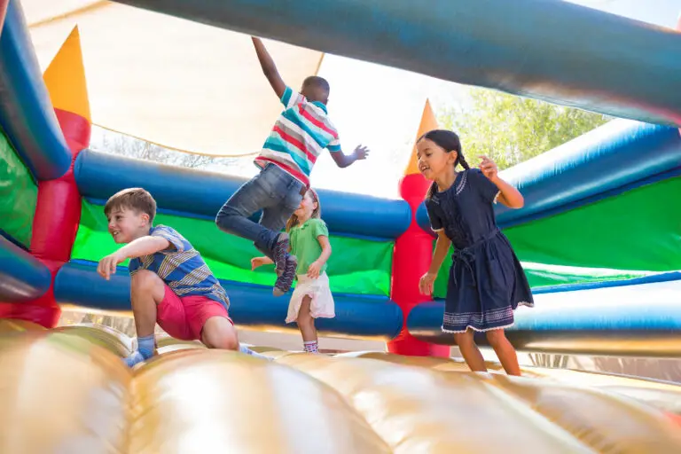 Children jumping on a bouncy castle - blog on the worst bouncy castle accidents and injuries by Bisnar Chase.