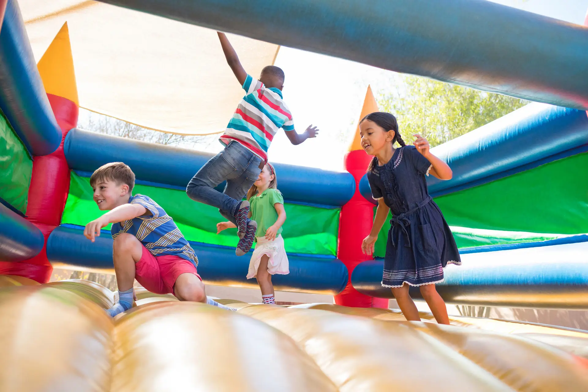 Children jumping on a bouncy castle - blog on the worst bouncy castle accidents and injuries by Bisnar Chase.